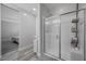 Bathroom featuring tiled shower with glass doors at 12525 Lylan Ridge St, Las Vegas, NV 89138
