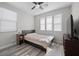 Bright bedroom featuring a ceiling fan and natural light from windows at 12525 Lylan Ridge St, Las Vegas, NV 89138