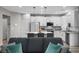 Stylish kitchen with white cabinets, granite countertops, and an island with seating at 12525 Lylan Ridge St, Las Vegas, NV 89138