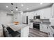 Bright kitchen with an island, stainless appliances and granite countertops at 12525 Lylan Ridge St, Las Vegas, NV 89138