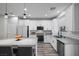 Spacious kitchen with an island, stainless appliances, and white cabinets at 12525 Lylan Ridge St, Las Vegas, NV 89138