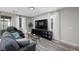 Cozy living room with hardwood floors, modern furniture, and natural light at 12525 Lylan Ridge St, Las Vegas, NV 89138