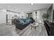 Open-concept living space with kitchen, living room, and sliding door access at 12525 Lylan Ridge St, Las Vegas, NV 89138