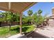 Lush backyard featuring a grass lawn and mature trees at 1371 Cumulus Ct, Henderson, NV 89014