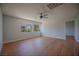 Bright bedroom with wood flooring, ceiling fan and sunlit windows at 1371 Cumulus Ct, Henderson, NV 89014