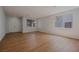 Bright, airy living room with wood floors, double front doors, and modern chandelier at 1371 Cumulus Ct, Henderson, NV 89014