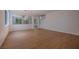 Spacious living room with wood floors, white walls, and a large window at 1371 Cumulus Ct, Henderson, NV 89014