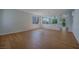 Empty living room features wood floors, white walls, and views into the neighboring spaces at 1371 Cumulus Ct, Henderson, NV 89014