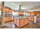 Gourmet kitchen with a center island, stainless steel appliances, and custom cabinetry at 1737 Cypress Manor Dr, Henderson, NV 89012