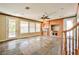 Living room with slate floors, a ceiling fan, fireplace, wood trim and built-in wooden cabinets at 1737 Cypress Manor Dr, Henderson, NV 89012