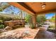 Outdoor patio with a rock waterfall feature flowing into a lush inground swimming pool and spa at 1737 Cypress Manor Dr, Henderson, NV 89012