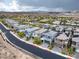 An aerial shot captures a residential area with modern homes, showcasing the community's street layout at 175 Strada Fontana, Henderson, NV 89011