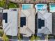 Aerial view of rooftops highlighting solar panels, manicured backyards, and community pools at 175 Strada Fontana, Henderson, NV 89011