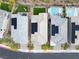 Aerial view of rooftops highlighting solar panels, manicured backyards, and a community pool at 175 Strada Fontana, Henderson, NV 89011