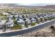 An aerial shot captures a residential area with modern homes, showcasing the community's street layout at 175 Strada Fontana, Henderson, NV 89011