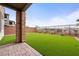 A well-maintained backyard features artificial turf and a paved patio area at 175 Strada Fontana, Henderson, NV 89011