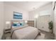 Staged bedroom with plush carpet, ample natural light, and a neutral color palette at 175 Strada Fontana, Henderson, NV 89011
