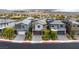 A street view showcases modern homes with well-maintained landscaping and paved driveways at 175 Strada Fontana, Henderson, NV 89011
