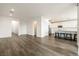Open-concept living area with modern decor, hardwood flooring, and access to the kitchen at 175 Strada Fontana, Henderson, NV 89011