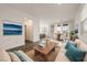 Staged living room with hardwood floors, modern furniture, and an open floor plan at 175 Strada Fontana, Henderson, NV 89011