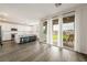 Bright, open living area with a kitchen view and sliding glass doors to the backyard at 175 Strada Fontana, Henderson, NV 89011