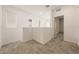 Upstairs loft area with neutral carpet, bright natural light from the windows, and an open doorway at 175 Strada Fontana, Henderson, NV 89011