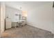 Well-lit home office area featuring a dedicated desk space, neutral walls, and carpeted floors at 175 Strada Fontana, Henderson, NV 89011