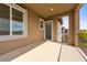 Exterior view of a covered balcony showcasing wrought iron railing and a view at 175 Strada Fontana, Henderson, NV 89011