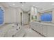 Elegant bathroom featuring a luxurious tub, double sinks, and marble countertops at 1809 White Hawk Ct, Las Vegas, NV 89134