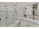 Bathroom featuring a glass shower, marble countertop, and modern fixtures at 1809 White Hawk Ct, Las Vegas, NV 89134