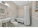 Elegant bathroom featuring a clawfoot tub and stylish vanity with marble tile accents at 1809 White Hawk Ct, Las Vegas, NV 89134