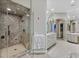 Well appointed bathroom with a marble shower, marble counters, and spacious layout at 1809 White Hawk Ct, Las Vegas, NV 89134