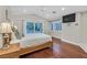 Bright bedroom with hardwood floors and sliding glass doors leading to the backyard at 1809 White Hawk Ct, Las Vegas, NV 89134