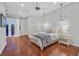 Serene bedroom with hardwood floors, neutral color palette, and access to a private balcony, offering a peaceful retreat at 1809 White Hawk Ct, Las Vegas, NV 89134