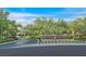 View of the Eagle Hills community entrance with lush greenery and blue sky at 1809 White Hawk Ct, Las Vegas, NV 89134