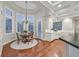 Charming breakfast nook with ample natural light and a cozy chandelier at 1809 White Hawk Ct, Las Vegas, NV 89134