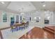Dining room features hardwood floors, a chandelier, and a glass door leading to the backyard at 1809 White Hawk Ct, Las Vegas, NV 89134