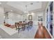 The dining area has hardwood floors and a chandelier; it opens to the kitchen through a doorway at 1809 White Hawk Ct, Las Vegas, NV 89134