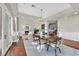 The dining room has hardwood floors, chandelier lighting, and a view of the living room and front entry at 1809 White Hawk Ct, Las Vegas, NV 89134