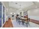 Dining area showcases hardwood floors, a chandelier, and opens to the living area at 1809 White Hawk Ct, Las Vegas, NV 89134