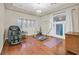 Exercise room featuring hardwood floors, natural light, and fitness equipment at 1809 White Hawk Ct, Las Vegas, NV 89134
