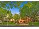 Well-manicured front yard with mature trees and manicured landscaping at 1809 White Hawk Ct, Las Vegas, NV 89134