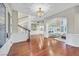 Elegant foyer with hardwood floors, staircase, and view into the living room at 1809 White Hawk Ct, Las Vegas, NV 89134