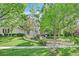 Well-manicured lawn and garden leading to an elegant home with a classic architectural design at 1809 White Hawk Ct, Las Vegas, NV 89134