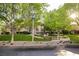 Inviting home exterior with manicured lawn, mature trees, and flowering plants at 1809 White Hawk Ct, Las Vegas, NV 89134