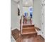 Hallway with hardwood floors that leads to a brightly lit room, offering a seamless transition between spaces at 1809 White Hawk Ct, Las Vegas, NV 89134