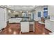 Modern kitchen featuring granite countertops, stainless steel appliances, and hardwood floors at 1809 White Hawk Ct, Las Vegas, NV 89134