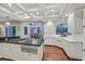 Bright kitchen with granite countertops, an island cooktop, and hardwood floors at 1809 White Hawk Ct, Las Vegas, NV 89134