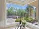 Bright kitchen window with a view of the lush, well-manicured backyard at 1809 White Hawk Ct, Las Vegas, NV 89134