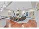 Elegant living room with a fireplace and adjacent formal dining room and bar at 1809 White Hawk Ct, Las Vegas, NV 89134
